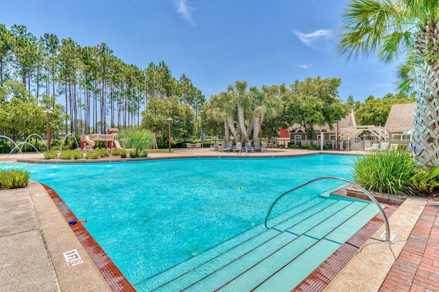 view of swimming pool featuring pool water feature