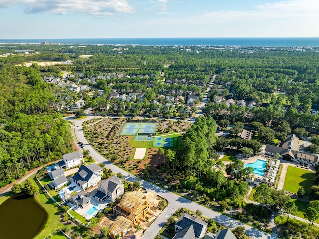 aerial view featuring a wooded view