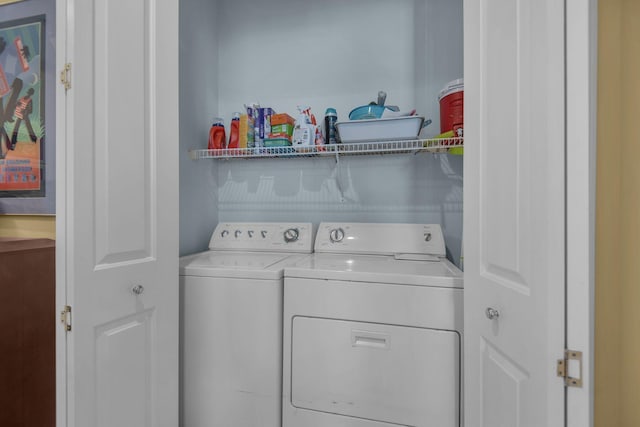clothes washing area with laundry area and separate washer and dryer