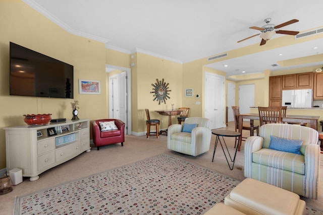 living area featuring visible vents, light carpet, ceiling fan, and crown molding