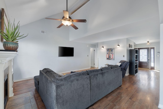 living room with ceiling fan, dark hardwood / wood-style flooring, and vaulted ceiling