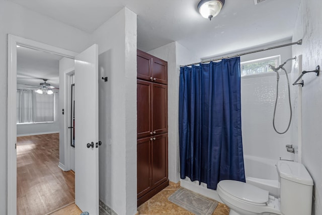 bathroom featuring hardwood / wood-style flooring, ceiling fan, toilet, and shower / tub combo