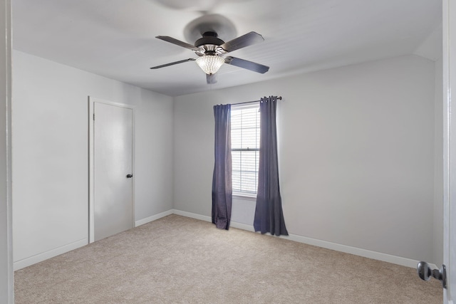 unfurnished room with light carpet, ceiling fan, and lofted ceiling