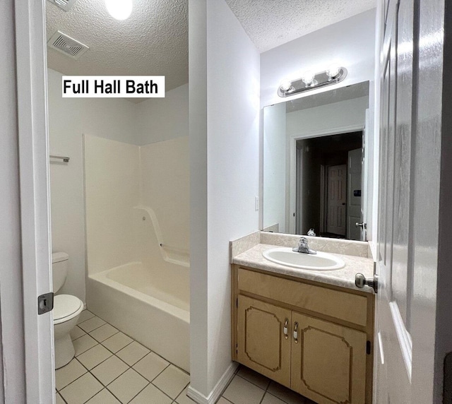 full bathroom with tile patterned flooring, a textured ceiling, toilet, shower / tub combination, and vanity