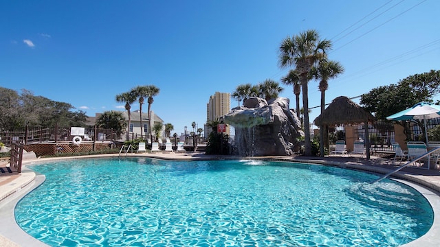 view of swimming pool featuring a gazebo and pool water feature