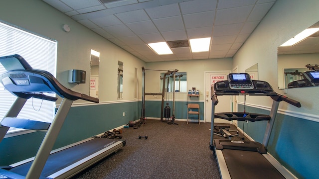 exercise area with a paneled ceiling