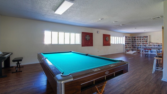 game room with a textured ceiling, dark hardwood / wood-style flooring, and pool table