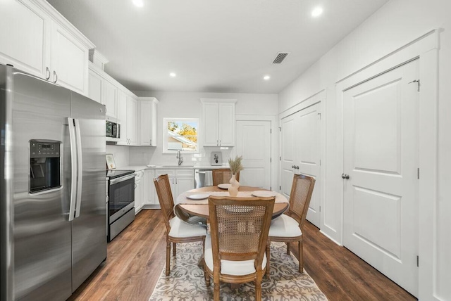 dining space featuring dark hardwood / wood-style floors