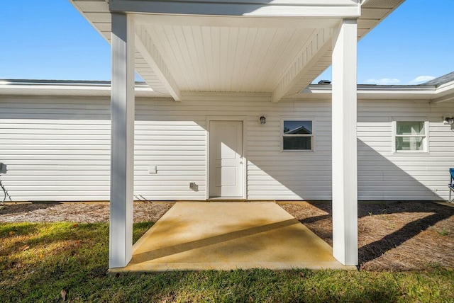 property entrance featuring a patio