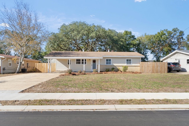 ranch-style home featuring a front yard