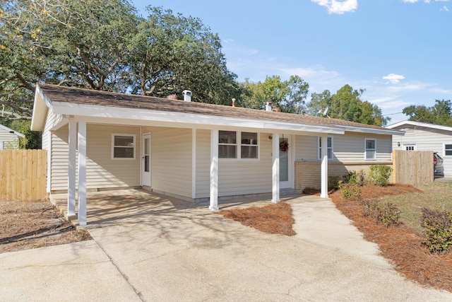 view of front of home with a carport