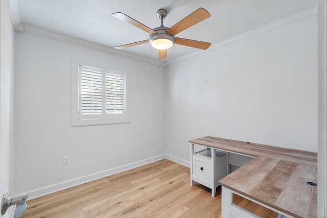 home office featuring ceiling fan, light wood-type flooring, and ornamental molding