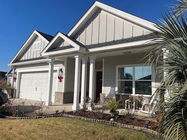 view of front of home with a garage and a front lawn