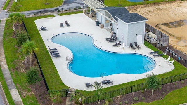 view of swimming pool featuring a patio area