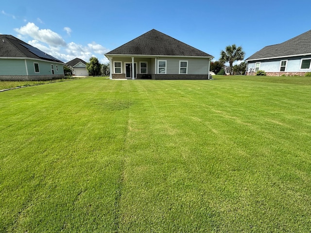 238 Partridge Ln, Freeport, FL 32439 - rear view of house featuring a lawn