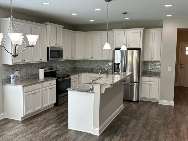 238 Partridge Ln, Freeport, FL 32439 - kitchen featuring appliances with stainless steel finishes, backsplash, dark wood-style floors, white cabinets, and recessed lighting