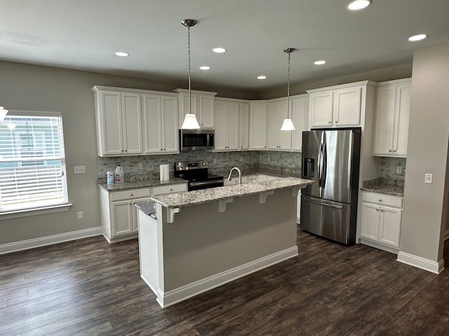 238 Partridge Ln, Freeport, FL 32439 - kitchen featuring appliances with stainless steel finishes, tasteful backsplash, white cabinetry, dark wood-style floors, and recessed lighting