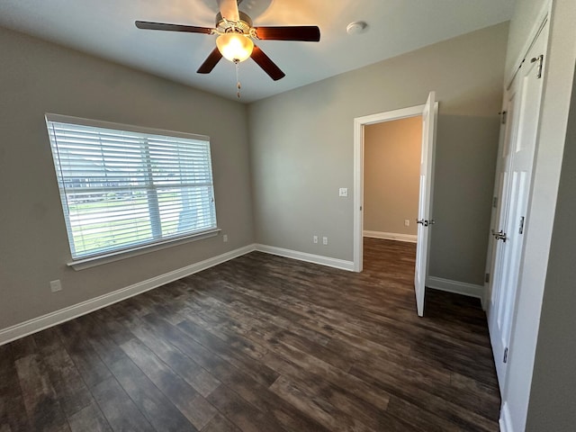 238 Partridge Ln, Freeport, FL 32439 - spare room with a smoke detector, dark wood-type flooring, and a ceiling fan