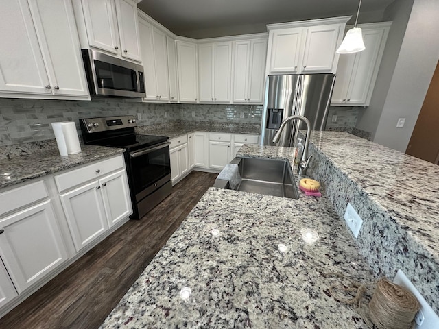 238 Partridge Ln, Freeport, FL 32439 - kitchen featuring stainless steel appliances, dark wood-style floors, and white cabinetry