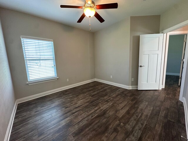 238 Partridge Ln, Freeport, FL 32439 - empty room with dark wood-style floors and a ceiling fan