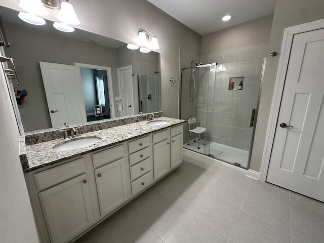 238 Partridge Ln, Freeport, FL 32439 - full bath featuring a stall shower, double vanity, and tile patterned floors