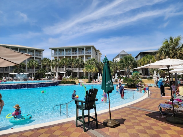 view of pool with pool water feature