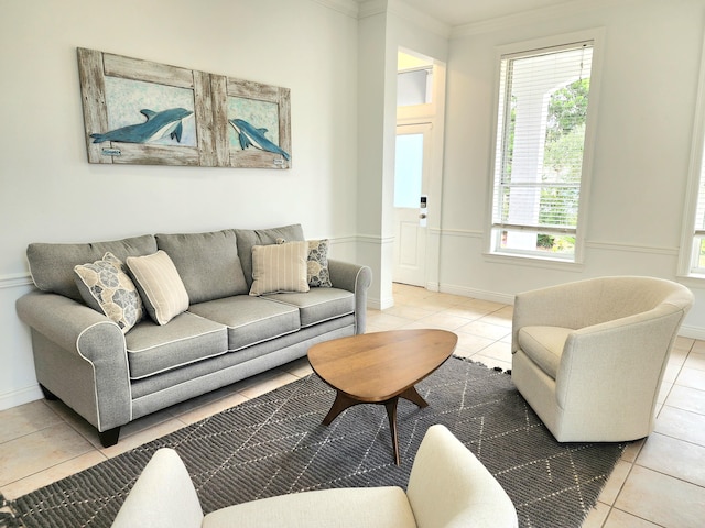 tiled living room featuring crown molding and a healthy amount of sunlight