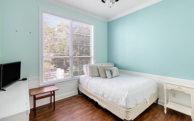 bedroom featuring ornamental molding and dark hardwood / wood-style floors