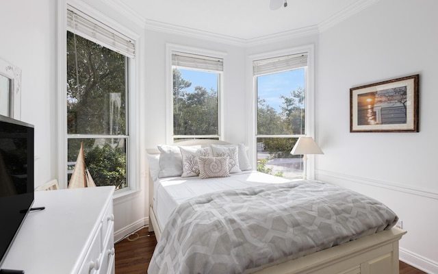 bedroom featuring multiple windows, crown molding, and dark hardwood / wood-style floors