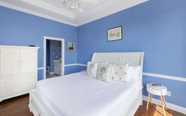 bedroom with ornamental molding, dark hardwood / wood-style floors, connected bathroom, and ceiling fan