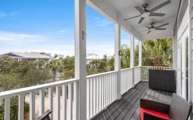 wooden deck featuring ceiling fan