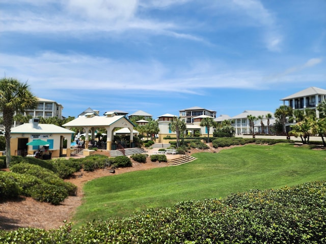 surrounding community featuring a gazebo and a lawn