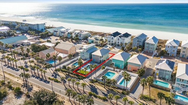 aerial view with a water view and a view of the beach