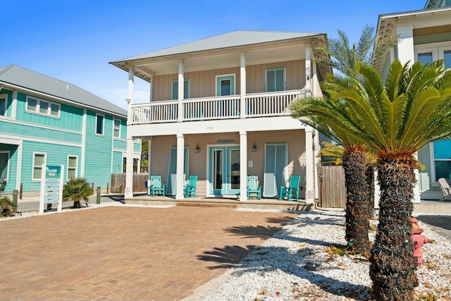 view of front of home with a porch and a balcony