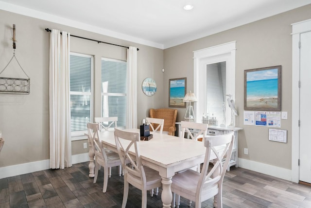 dining space featuring a wealth of natural light and wood-type flooring