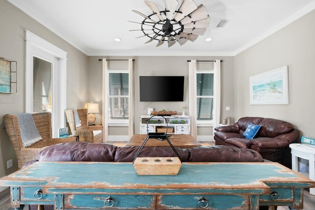 living room featuring hardwood / wood-style floors and ornamental molding