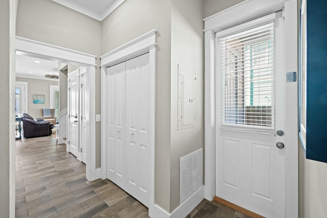 foyer with hardwood / wood-style floors and electric panel