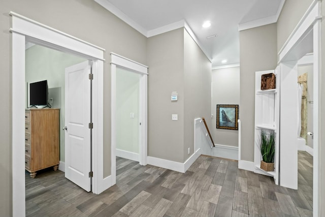 hallway featuring hardwood / wood-style floors and ornamental molding