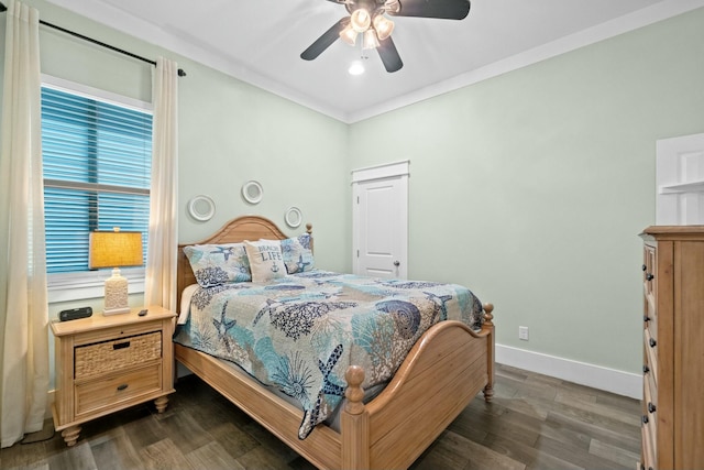 bedroom featuring ceiling fan, dark hardwood / wood-style floors, and ornamental molding