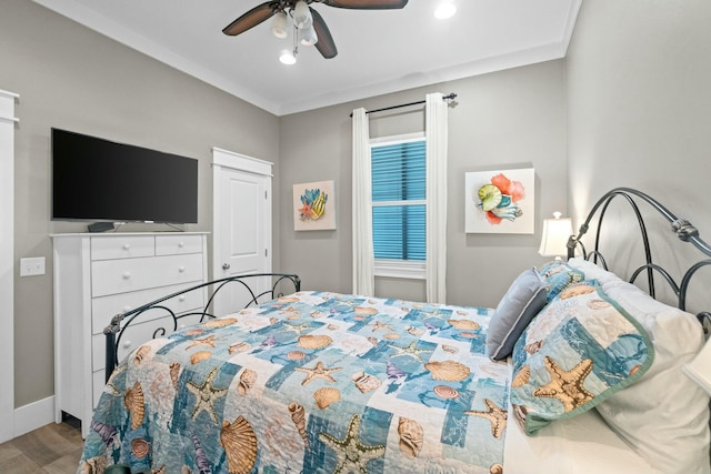 bedroom with ceiling fan and light wood-type flooring