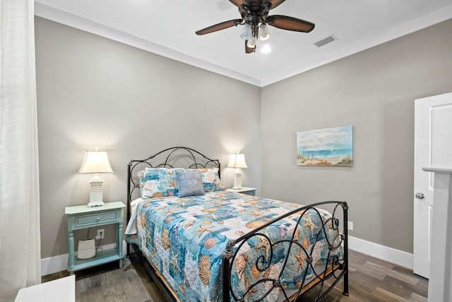 bedroom featuring ceiling fan and dark wood-type flooring