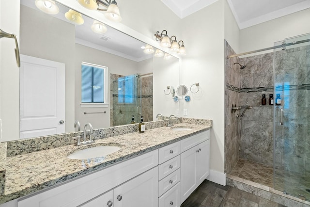 bathroom featuring hardwood / wood-style floors, a shower with shower door, and ornamental molding