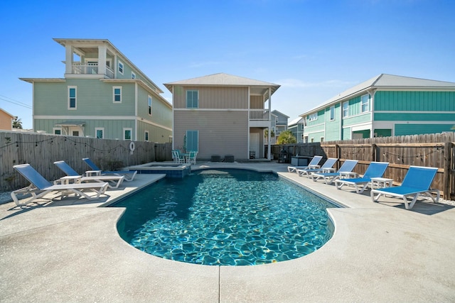 view of swimming pool featuring a patio area