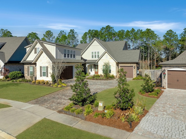 view of front of home featuring a garage and a front lawn