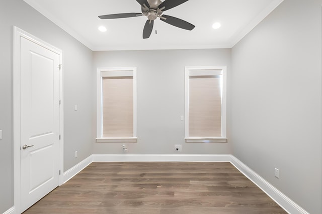 unfurnished room featuring dark hardwood / wood-style flooring, ceiling fan, and crown molding