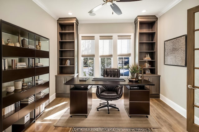 home office featuring ceiling fan, light hardwood / wood-style floors, and crown molding