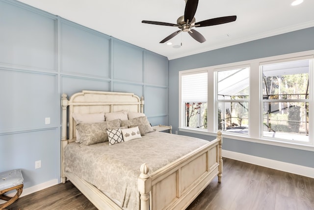 bedroom with ceiling fan, dark hardwood / wood-style flooring, and crown molding