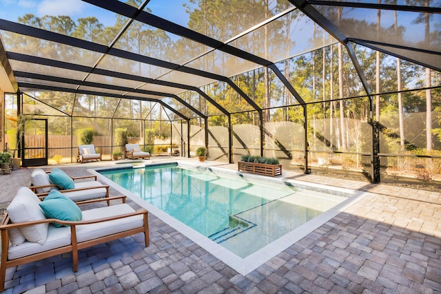 view of pool featuring a patio and glass enclosure