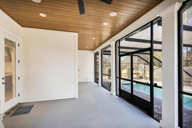 unfurnished sunroom with wood ceiling and a healthy amount of sunlight