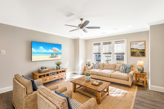 living room featuring ceiling fan, dark hardwood / wood-style flooring, and ornamental molding